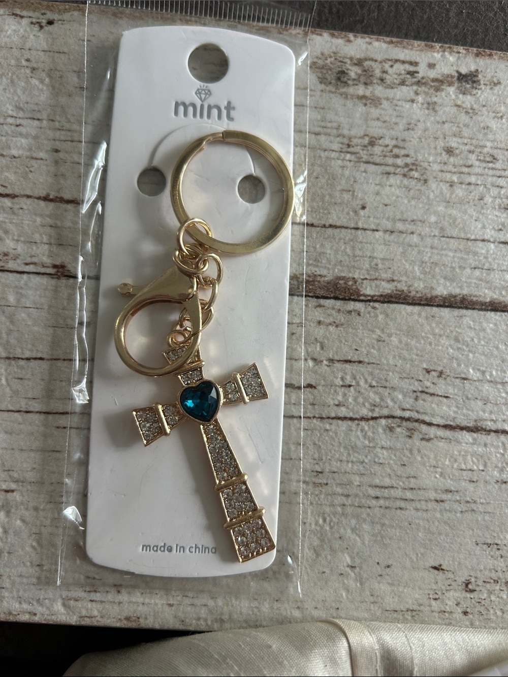 5/)25 Mint Gold Cross Keychain with Blue Heart Accent